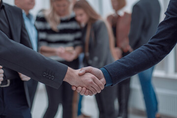 Business people shaking hands at the meeting