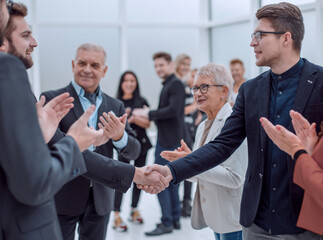 Business people shaking hands at the meeting