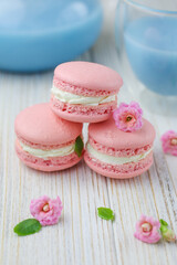 Pink macaroons with the glass pot of blue masala tea