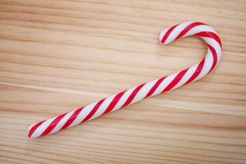 Candy cane on wooden background
