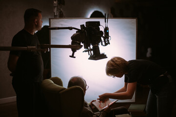 Director of photography with a camera in his hands on the set.