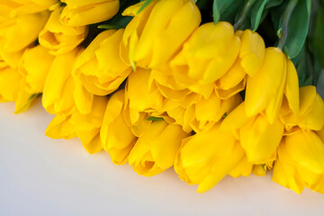 A bouquet of yellow tulips. Bouquet of fresh tulips close-up. Spring flowers in the interior. The concept of spring or holiday, March 8, International Women's Day,