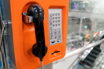 Public payphone telephone inside the international airport. Public telephone corner for passenger...