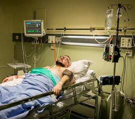 Man on hospital bed for recovery , high photo 