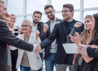 Businessteam is introducing a colleague to another businessman