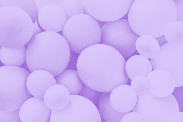 Lavender balloons background, punchy pastel violet colored and soft focus. Party festive balloons photo wall birthday decoration for children. Background for wedding, anniversary, birthday.