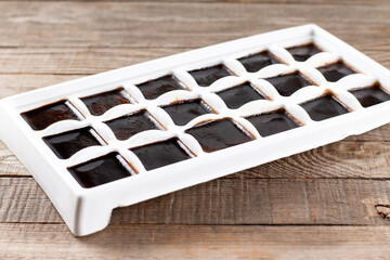 Cubes of frozen coffee in the form of ice
