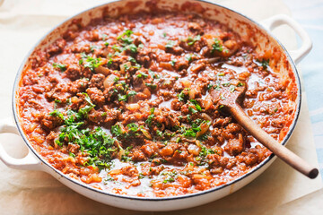 Bolognese beef sauce with tomatoes and parsley 