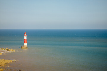 Lighthouse on the beach on the North Sea. Sea in England. Lighthouse in water 