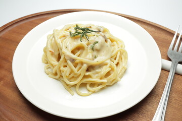 Carbonara spaghetti on a wood tray