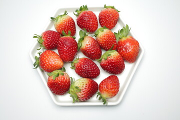 Heap of fresh strawberries in white ceramic dish
