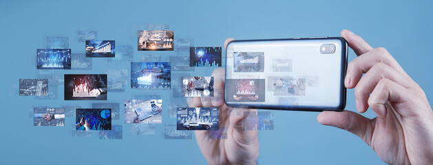 Male hands with a smartphone taking a digital pictures of business graphs. Business. Technology
