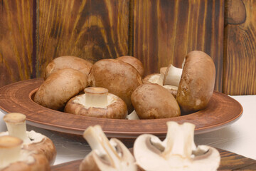 Edible mushrooms close-up, selective focus. Royal brown champignons