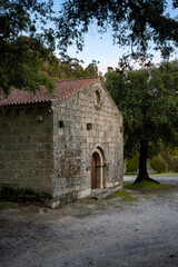 Fototapeta na wymiar Landscape view of Sao Pedro chapel with trees and boulders in Monsanto, Portugal