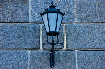 Street lantern lamp on brick wall
