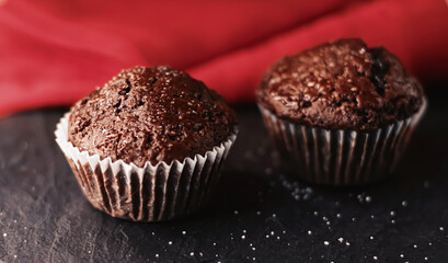 Two chocolate muffins freshly baked at home, homemade comfort food recipe