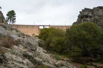Fototapeta na wymiar Penha Garcia Dam on a cloudy day with tree nature landscape, in Portugal