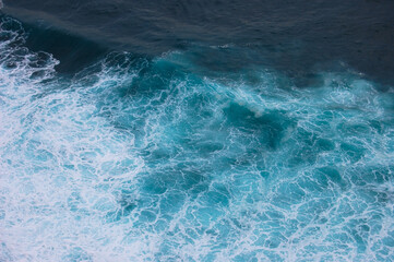 Fototapeta na wymiar Sea surface background with waves and foam