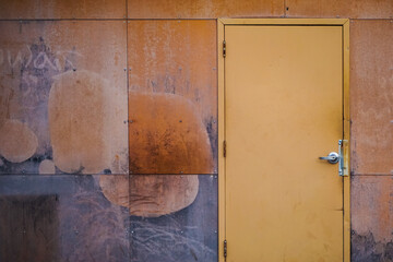 Old metal rusty wall with door