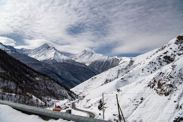 panoramic views of the snow-capped white mountains and bright blue sky 