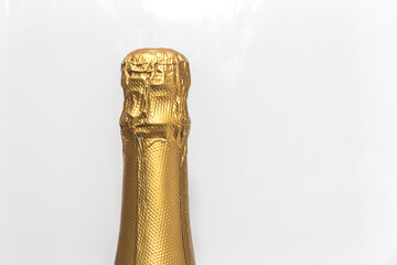 Closed bottle of champagne. Festive alcohol. Champagne bottle isolated.