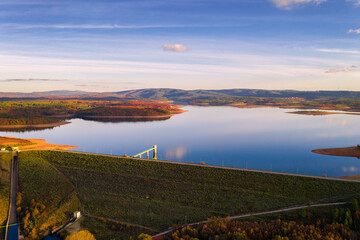 Drone aerial panoramic view of Sabugal Dam lake reservoir with perfect reflection, in Portugal