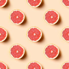 Seamless pattern of grapefruit slice on beige background. Food summer pattern.