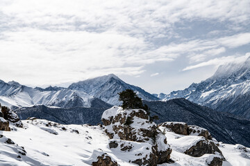 panoramic views of the snow-capped white mountains and bright blue sky 
