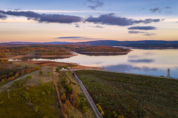 Fototapeta na wymiar Drone aerial panoramic view of Sabugal Dam lake reservoir with perfect reflection, in Portugal