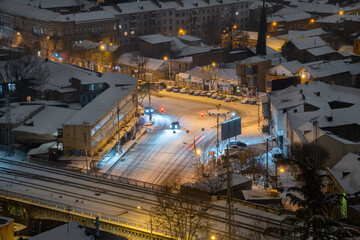 Fototapeta premium Snow in the night city