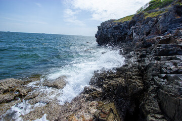 rocks and sea ,waves crashing on rocks , tropical island , Koh SiChang, Chon Buri, Thailand