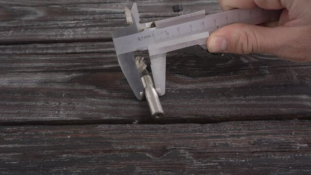 the diameter of the drill is measured with a caliper