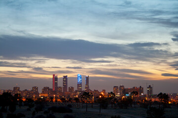 Fototapeta premium Madrid skyline at sunset, highlighting the four towers of the financial district to the north of the city