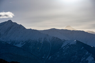 panoramic landscape of the snow-capped mountains and gorges of the Caucasus 