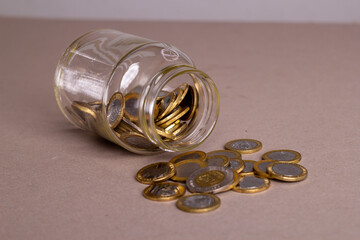 close view dominican money in a glass jar