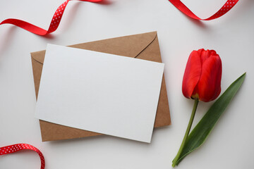 postcard mockup. spring flowers. tulips of red tulips on white background and space for text