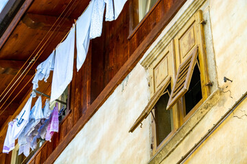 Lanudry drying outside of house in Italy