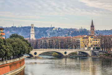 Fototapeta na wymiar Beautiful panorama of Adige River waterfront in Verona, Italy.