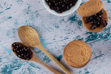 Top view of fresh cookie with jam over white background