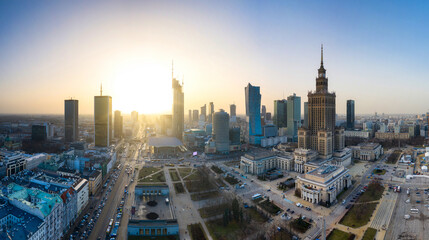 Panorama of Warsaw city center with modern architecture at sunset.