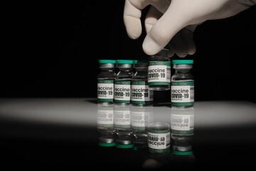 The doctor takes vials of the coronavirus vaccine. Coronavirus vaccine. Experimental covidvirus...