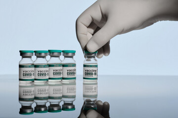The doctor takes vials of the coronavirus vaccine. Coronavirus vaccine. Experimental covidvirus...