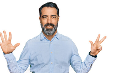 Middle aged man with beard wearing business shirt showing and pointing up with fingers number eight while smiling confident and happy.