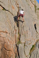 Fototapeta premium Climbing on a rock in Brittany. France