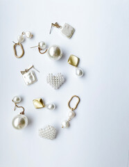 Accessories background. Set of beautiful precious jewelry made of gold, silver, and pearls. Fashion photos