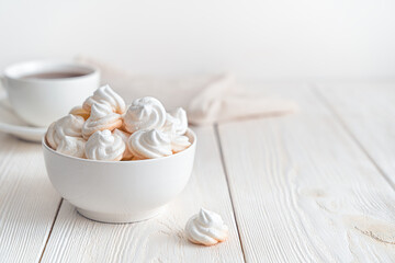 Swiss meringues on a soft light background. Side view