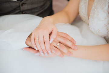 Obraz na płótnie Canvas hands of the newlyweds. romance. wedding rings