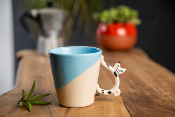 ceramic coffee cup on wooden table