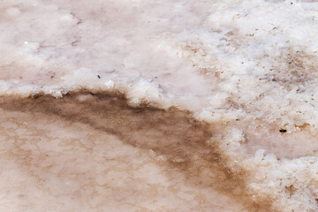 Pink salt in salt lake as textured background. Salt background.