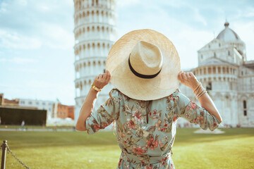 Seen from behind woman in floral dress enjoying promenade